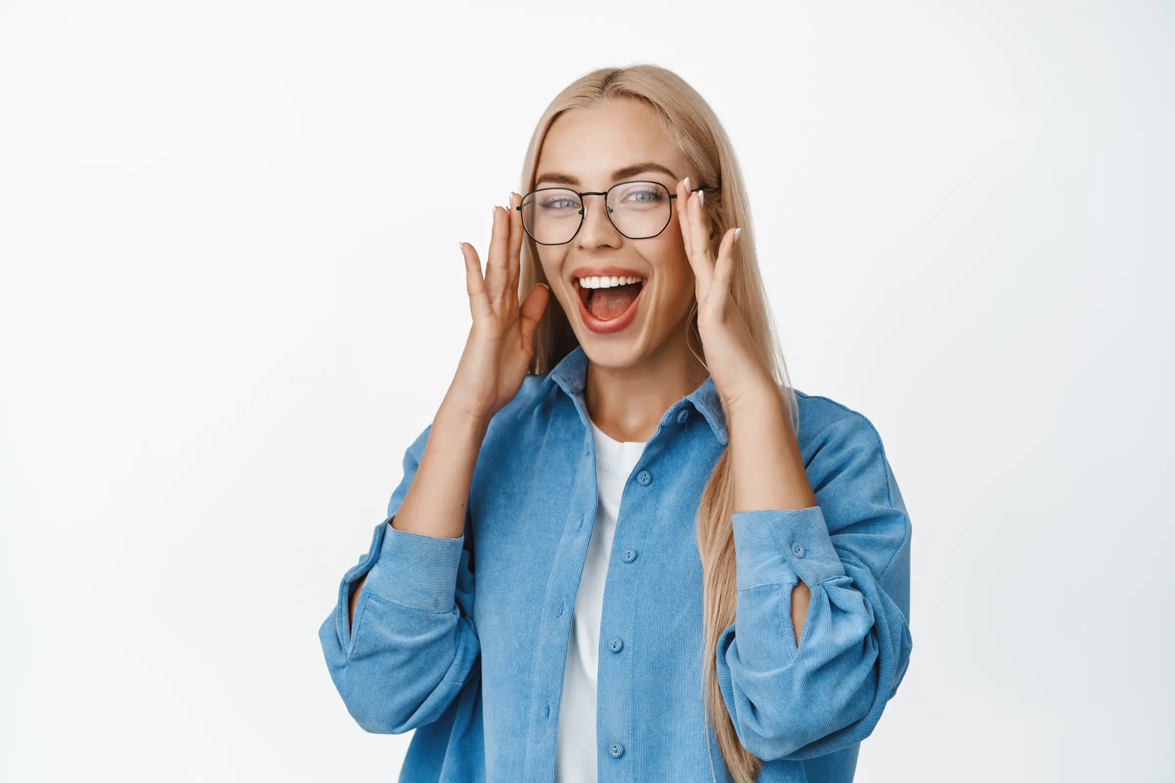 beautiful-blond-woman-put-glasses-laughing-smiling-with-happy-face-expression-standing-blue-shirt-wh beautiful-blond-woman-put-glasses-laughing-smiling-with-happy-face-expression-standing-blue-shirt-wh