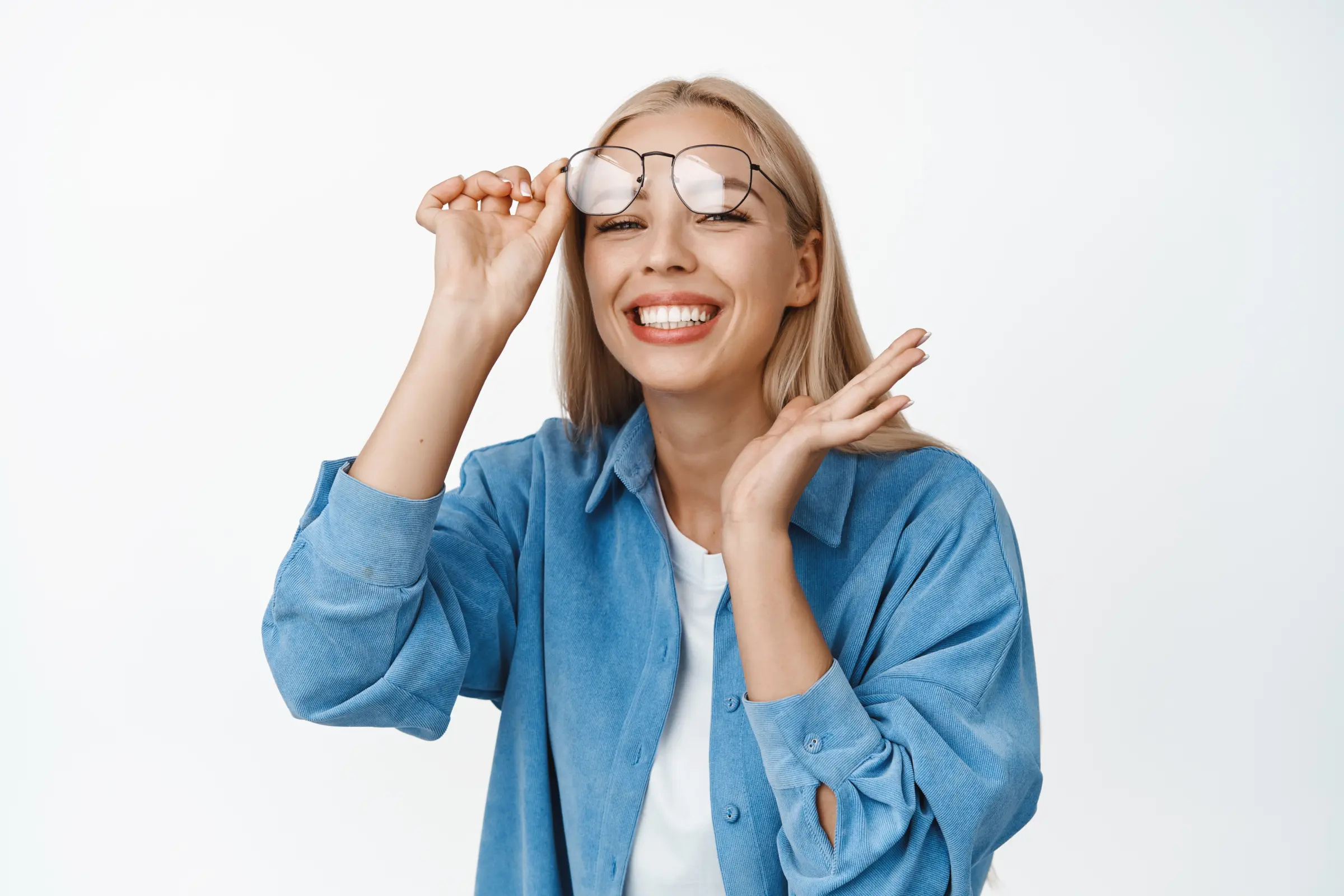 beautiful-young-woman-taking-off-glasses-smiling-looking-excited-standing-happy-against-white-backgr